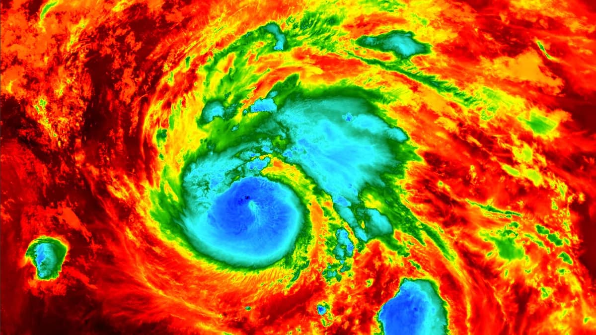Illustration of a hurricane approaching a coastline with a wind-speed gauge showing changing readings