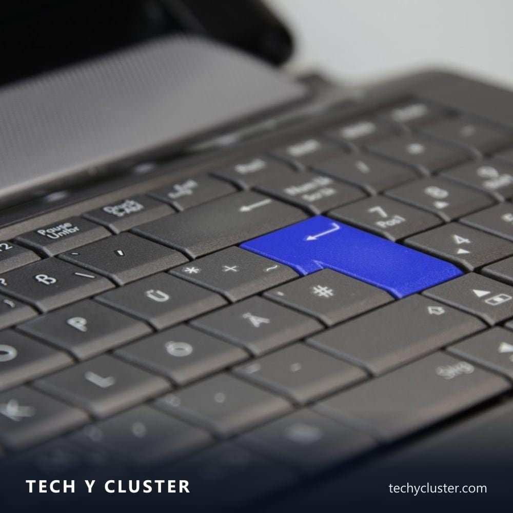Close-up of a keyboard with a blue Enter key