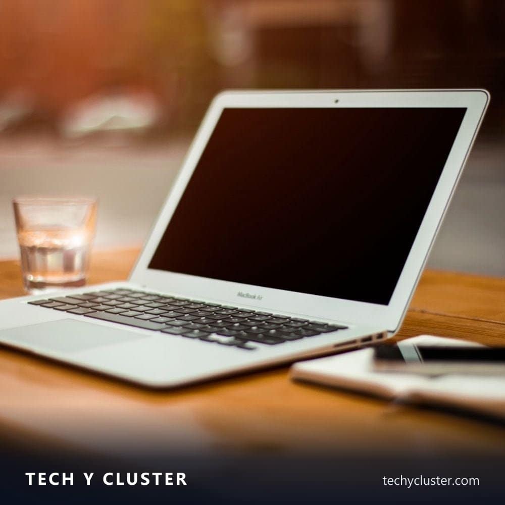 Open laptop on a wooden desk