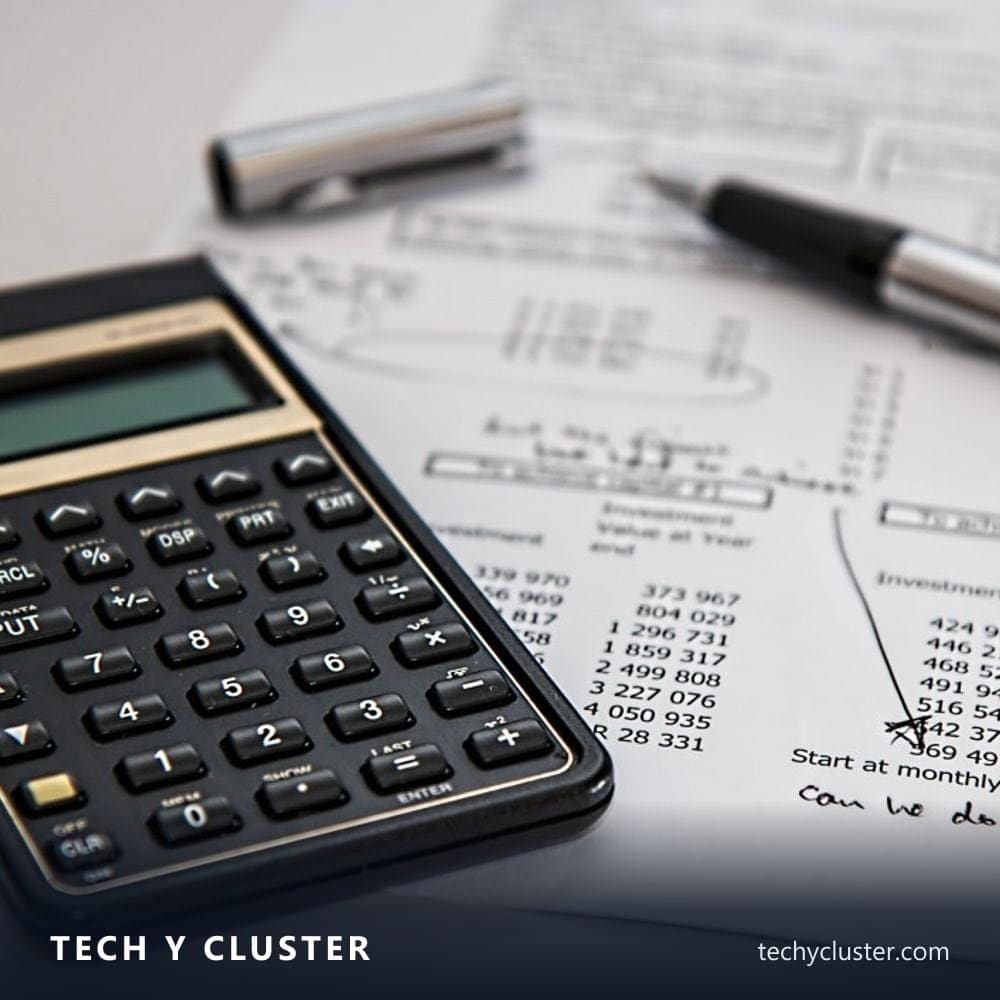 Calculator and pen on a sheet of financial figures