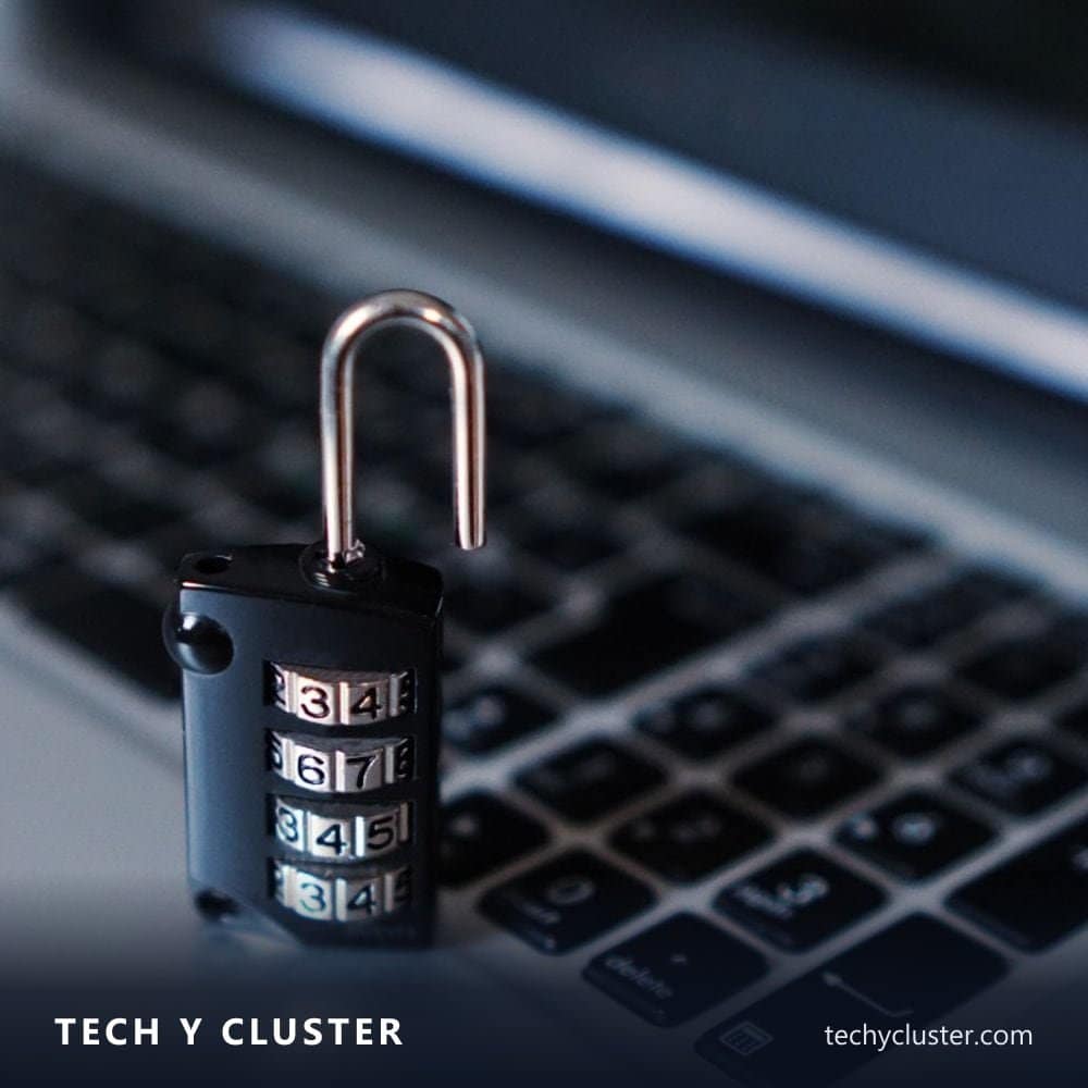 Combination padlock resting on a laptop keyboard