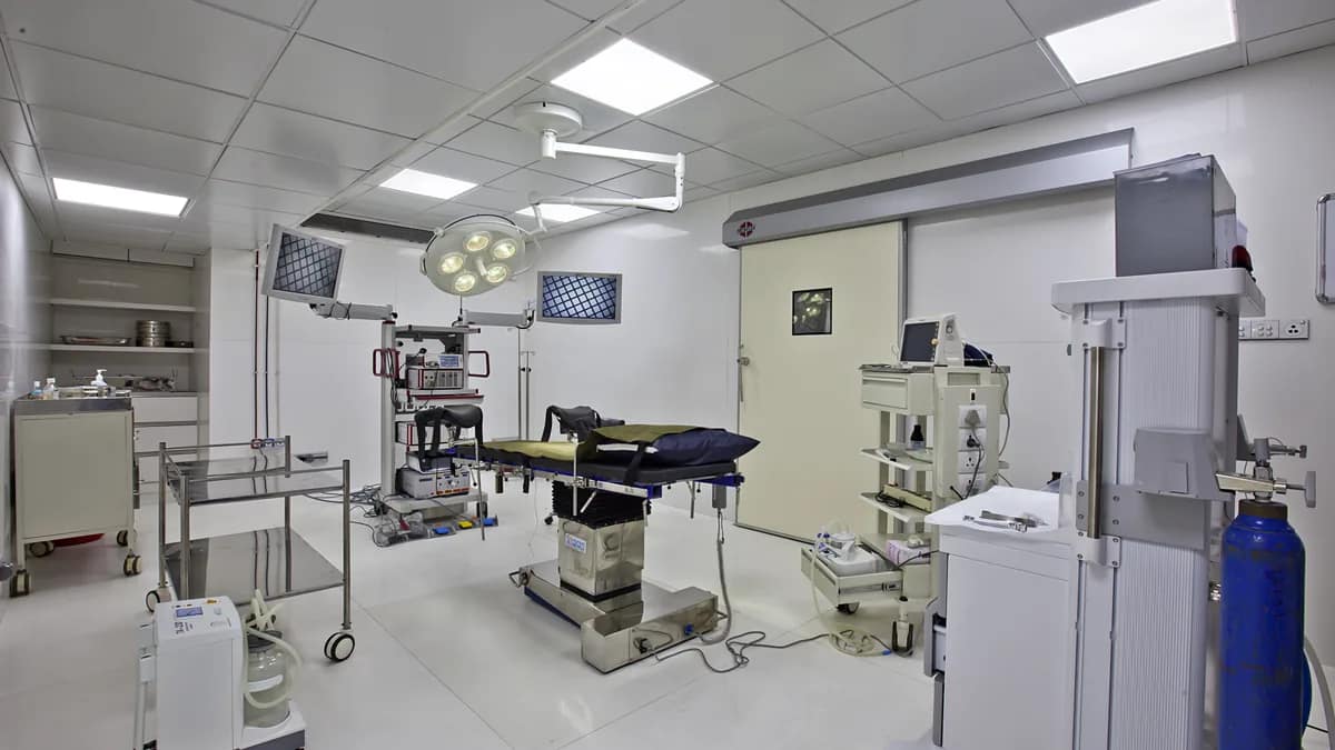 Operating room with surgical monitor displaying a video feed during minimally invasive surgery